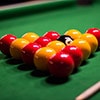 Pool balls set up in a triangle on a table