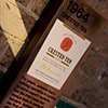 Close up of a sign detailing Jameson history on a brick wall