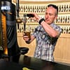 A man pulling a pint in The Guinness Academy