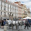 A horse and carriage in the square in Prague