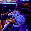 A man and woman sat together in a club