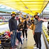 Men and women posing for a picture at Prague's indoor karting centre