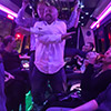 Some men dancing in a strip limo