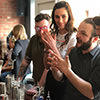 The cocktail mixologist teaching a group