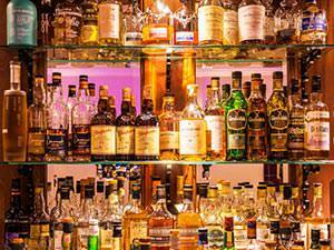 A group of people dancing in a nightclub under disco lights
