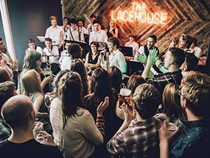 People partying in The Lacehouse, Nottingham, and watching the band on stage 