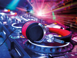 Image of headphones on CD turntables in a night club
