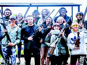 LNOF Staff posing at a shooting range whilst holding shotguns