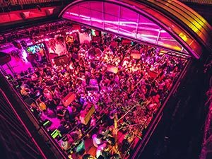 A ruin bar in Budapest full of people drinking and partying