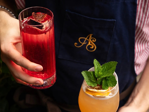 A popcorn cocktail with flames coming out of the top