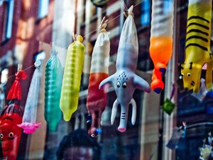 Line of novelty condoms in a shop window