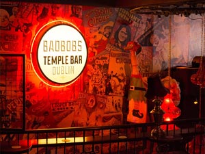 The Bad Bobs sign lit up against a wall