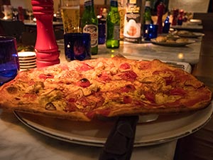 A pizza served up on a plate