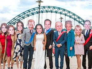 A group of Last Night of Freedom staff dressed in Royal Family masks on the Quayside