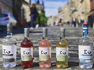 A close up of bottles of alcohol on a pavement