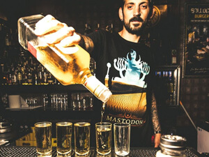 A bartender serving shots