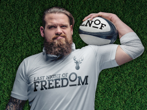 A rugby player sponsored by Last Night of Freedom holds a ball