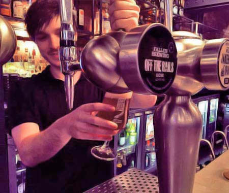 A bartender pulling a pint