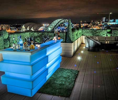 The blue bar on the roodtop of the Sky Lounge at night