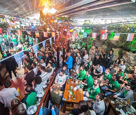 Some people celebrating in the outdoor section of one of Dublin
