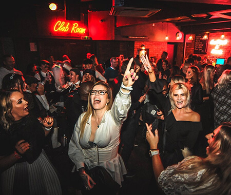 A group of women partying in a club