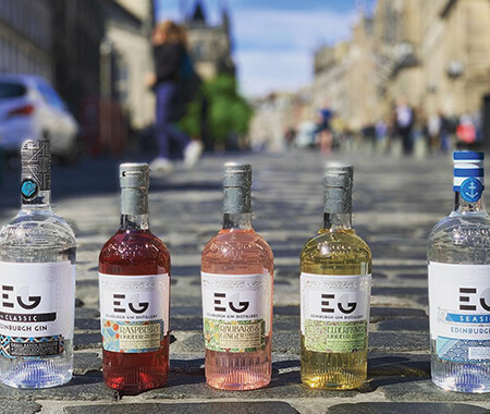 A close up of bottles of alcohol on a pavement