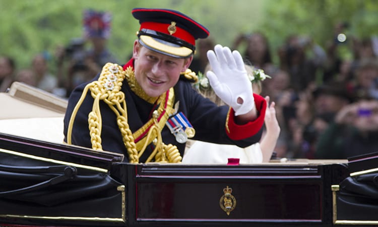 Prince Harry waving out of a car
