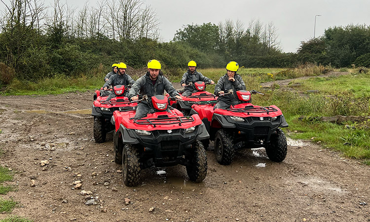 Five people on top of quad bikes ready to go at Max Events in Bristol. 