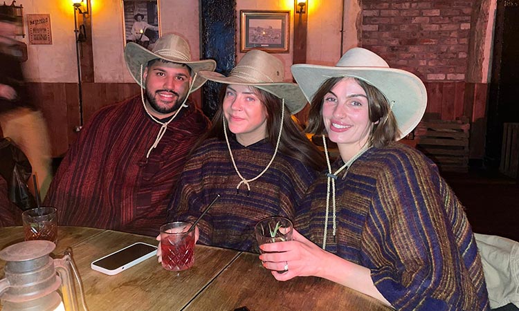 Akash, Christie and Jade wearing Cowboy hats at Moonshine Saloon