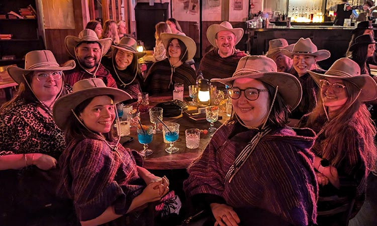  Team LNOF at Moonshine Saloon in Liverpool wearing cowboy hats and smiling 