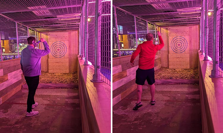 Two men throwing axes at targets in Boom Battle Bar in Liverpool