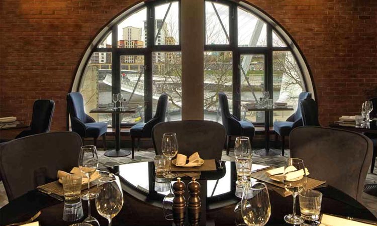 Chez Mal Bar with a table set overlooking The Quayside