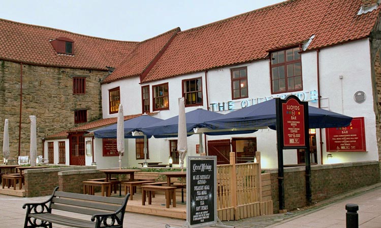 The exterior of The Quayside Wetherspoons with outdoor seating