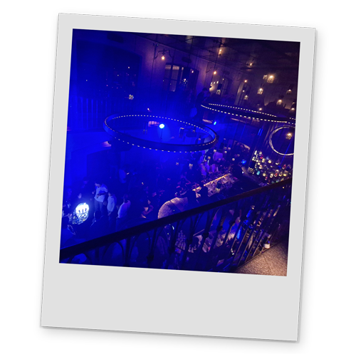 A polaroid style image of the interior of a nightclub