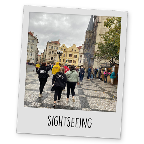 A polaroid style image of Team LNOF walking through Prague, with text reading 'Sightseeing' at the bottom