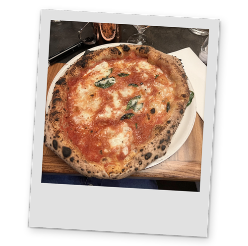 A polaroid style image of a rustic pizza