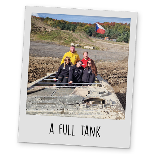 A polaroid style image of Team LNOF on a tank, with text reading 'A Full Tank' at the bottom