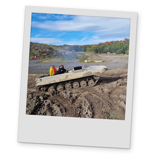 A polaroid style image of Team LNOF on a tank while it's moving