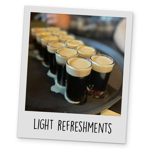 A polaroid style image of a tray of shots, with text reading 'Light Refreshments' at the bottom