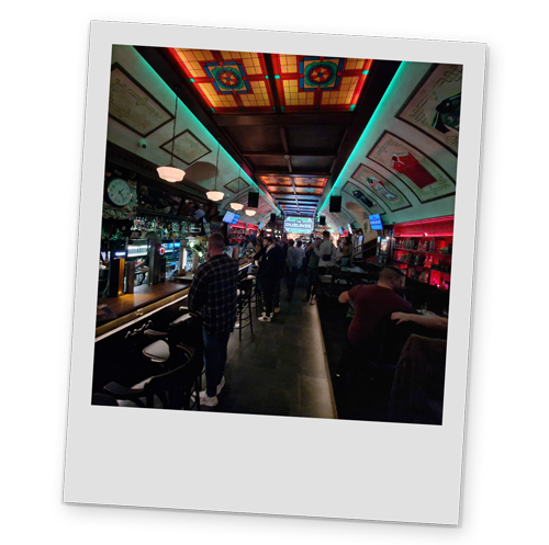 A polaroid style image of the interior of a bar