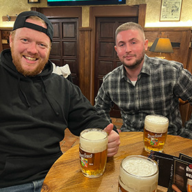  Two men with beers in Prague