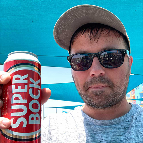  A male member of our team posing with a can of Super Bock beer