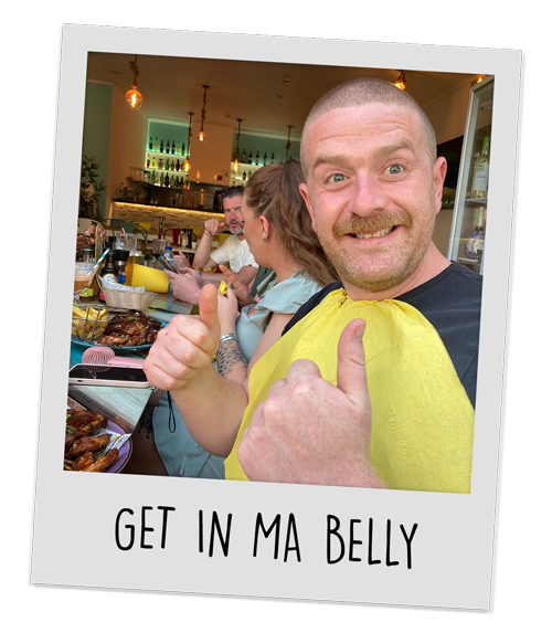 Our head of sales looking very pleased with the ribs he's about to eat with the caption 'get in ma belly'