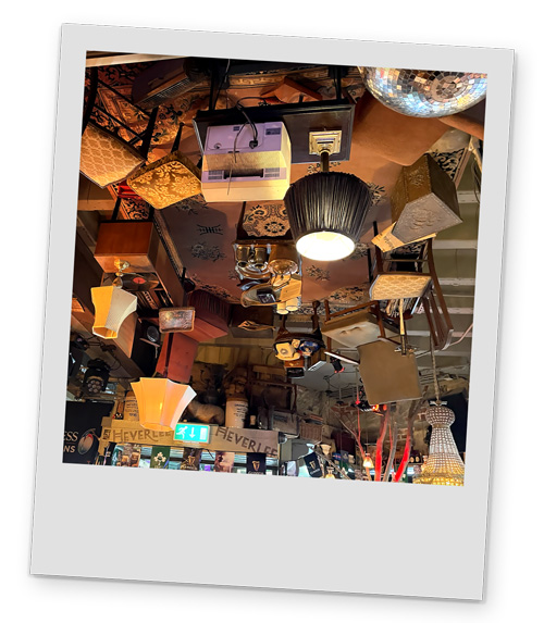 The ceiling of Granny Annies kitchen which has lots of upside down furniture on it, including lamps and a record player