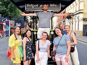 Team LNOF posing in front of the party bike