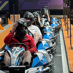 LNOF staff sat in go karts lined up ready to race 