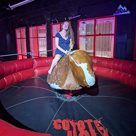  Hannah L sitting on a rodeo bull 