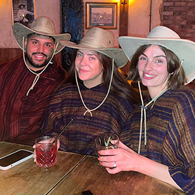  Akash, Christie and Jade wearing cowboy hats and ponchos 