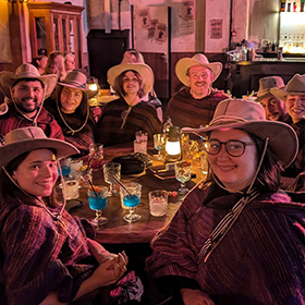 Team LNOF posing for the camera wearing cowboy hats 