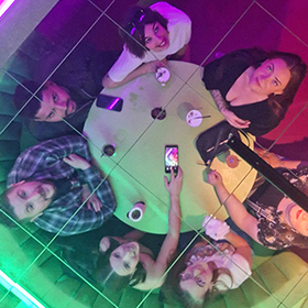  Team LNOF's reflection in a mirrored ceiling 